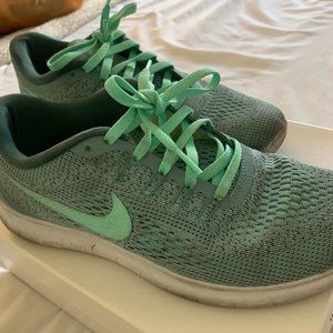 Turquoise Nike tennis shoes